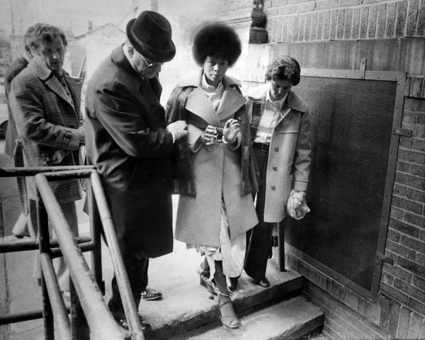 Assata Shakur being led away to trial shackled 1977
